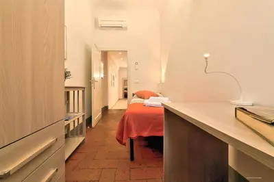 Letto o letti in una camera di Wine Apartments Florence Colorino