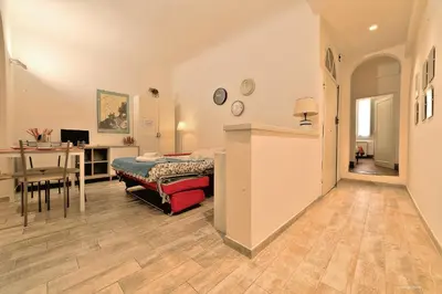 Letto o letti in una camera di Wine Apartments Florence Colorino