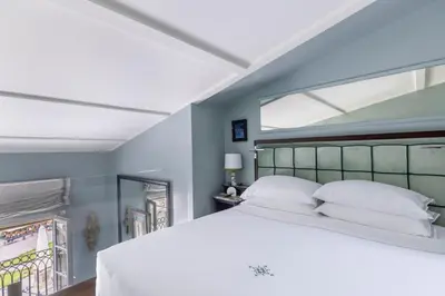 Letto o letti in una camera di The Place Firenze