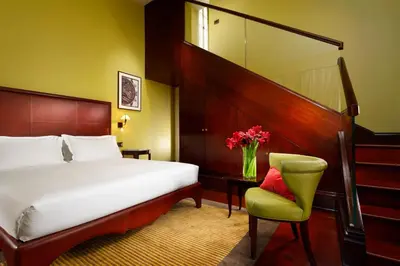 Letto o letti in una camera di Hotel L'Orologio Firenze - WTB Hotels