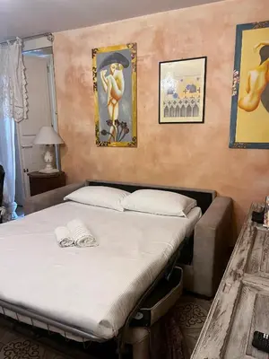 Letto o letti in una camera di Heart of Florence Serragli Apt 10' from Ponte Vecchio