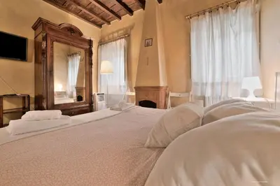 Letto o letti in una camera di Wine Apartments Florence Trebbiano