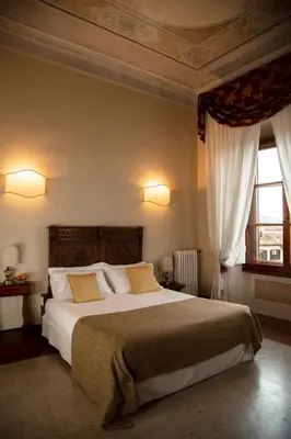 Letto o letti in una camera di Hotel Palazzo Guadagni