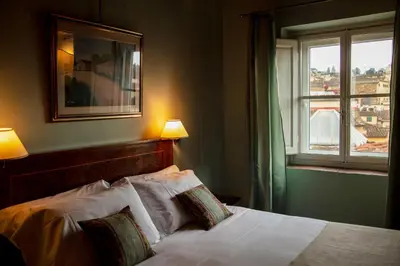 Letto o letti in una camera di Hotel Palazzo Guadagni