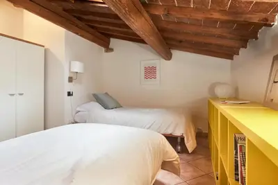 Letto o letti in una camera di Casa Cosi Masaccio
