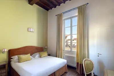 Letto o letti in una camera di Residenza Della Signoria