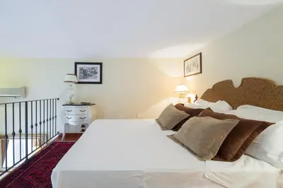 Letto o letti in una camera di Old Tower Ponte Vecchio Suite