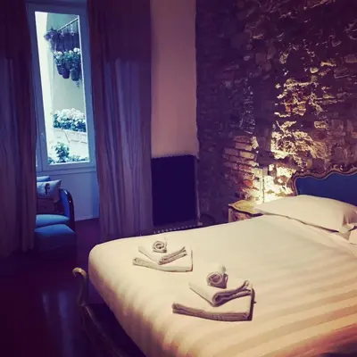Letto o letti in una camera di Velvet Loft - Santo Spirito Apartment