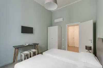 Letto o letti in una camera di Apartments Florence-Ginori Terrace