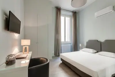 Letto o letti in una camera di Apartments Florence-Ginori Terrace