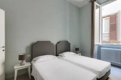 Letto o letti in una camera di Apartments Florence-Ginori Terrace