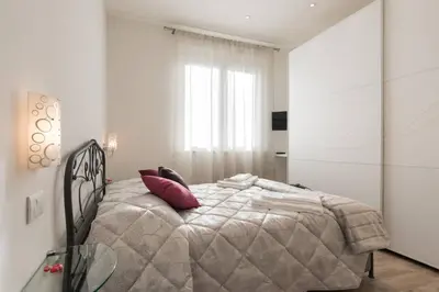 Letto o letti in una camera di Roommo Santa Maria Novella