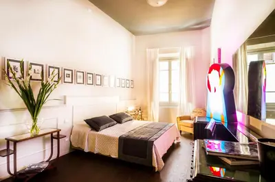 Letto o letti in una camera di Arnobio Florence Suites
