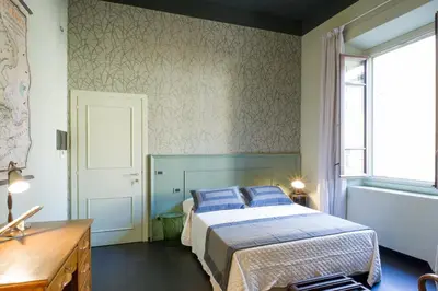 Letto o letti in una camera di Arnobio Florence Suites
