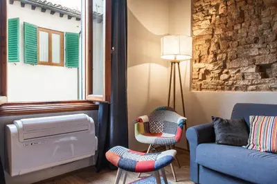 Area soggiorno di Boheme Apartment by Mamo Florence
