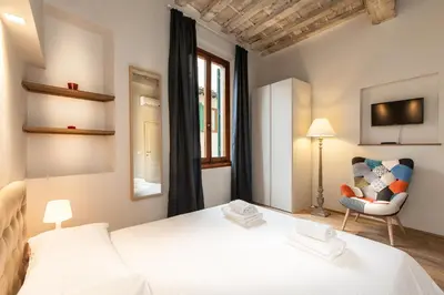 Letto o letti in una camera di Boheme Apartment by Mamo Florence