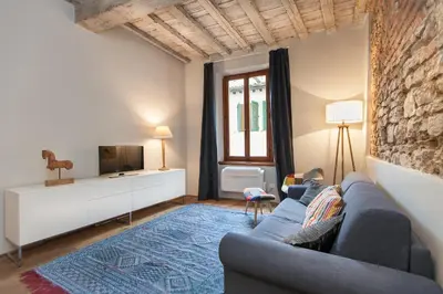 Area soggiorno di Boheme Apartment by Mamo Florence
