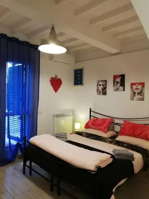 Letto o letti in una camera di B & B Eliana