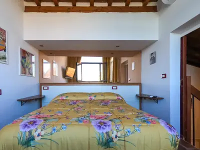 Letto o letti in una camera di Soggiorno Rubino