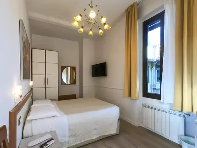 Letto o letti in una camera di Soggiorno Rubino