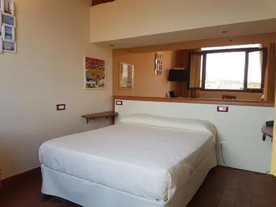 Letto o letti in una camera di Soggiorno Rubino