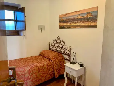 Letto o letti in una camera di Agriturismo Il Colle
