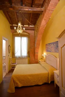 Letto o letti in una camera di B&B La Casa dei Tintori