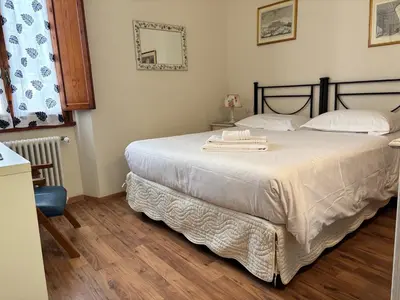 Letto o letti in una camera di Casa Campuccio -Appartamento Campuccio1 e Appartamento Campuccio 2