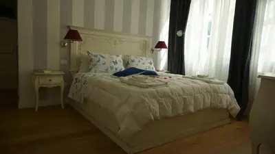 Letto o letti in una camera di Margherita Suite