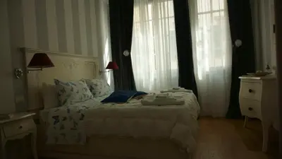Letto o letti in una camera di Margherita Suite