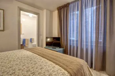Letto o letti in una camera di Faenza Elegant Apartment