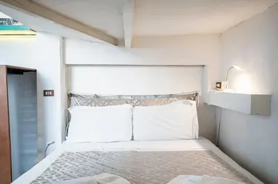Letto o letti in una camera di 12 Duomo - Monolocale centrale e silenzioso