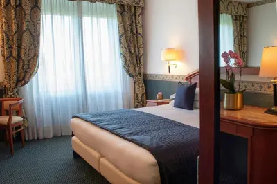 Letto o letti in una camera di Starhotels Vespucci