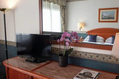 Letto o letti in una camera di Starhotels Vespucci