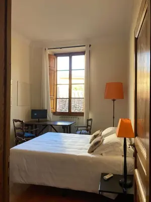 Letto o letti in una camera di Ponte Vecchio flat with elevator