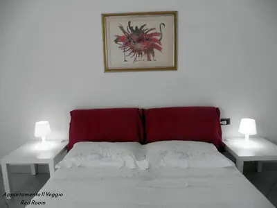Letto o letti in una camera di Appartamento il Veggio
