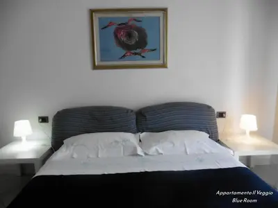 Letto o letti in una camera di Appartamento il Veggio