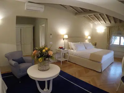 Letto o letti in una camera di Palazzo della Stufa Residenza D'Epoca