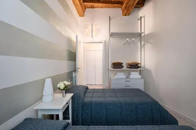 Letto o letti in una camera di Windows On Florence