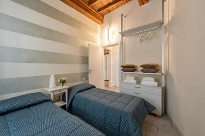 Letto o letti in una camera di Windows On Florence