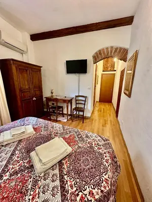 Letto o letti in una camera di Medici Suite - Appartamento Vintage 200m dal Duomo