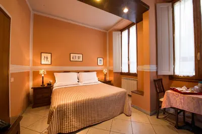 Letto o letti in una camera di B&B Old Florence Inn