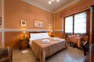 Letto o letti in una camera di B&B Old Florence Inn