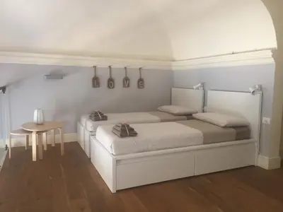 Letto o letti in una camera di Brunelleschi Suite