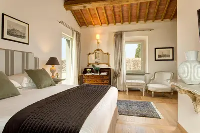 Letto o letti in una camera di Villa Le Calvane