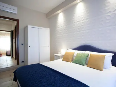 Letto o letti in una camera di Appartamento Alberto