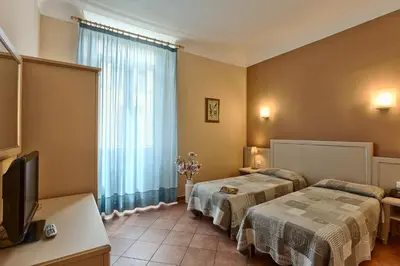 Letto o letti in una camera di Hotel Eden