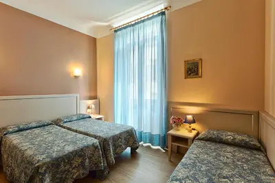 Letto o letti in una camera di Hotel Eden