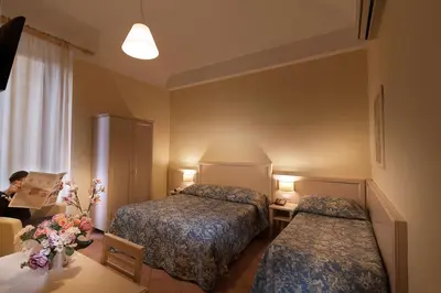 Letto o letti in una camera di Hotel Eden