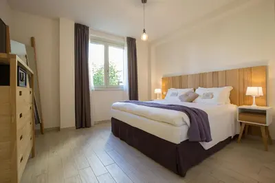 Letto o letti in una camera di Coco Places Firenze, Centro Storico